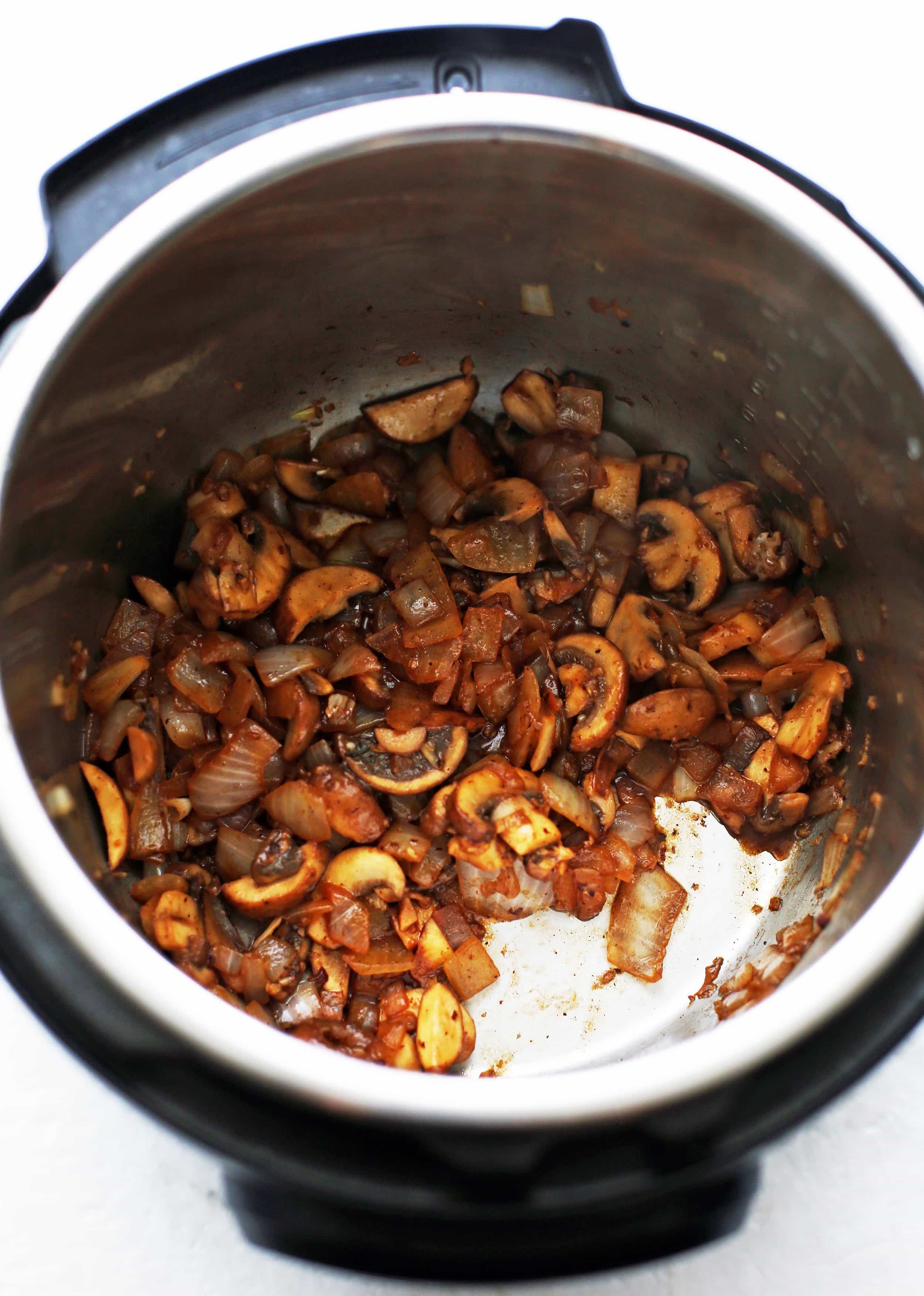 Sauteed onions, garlic, and mushrooms in the Instant Pot.
