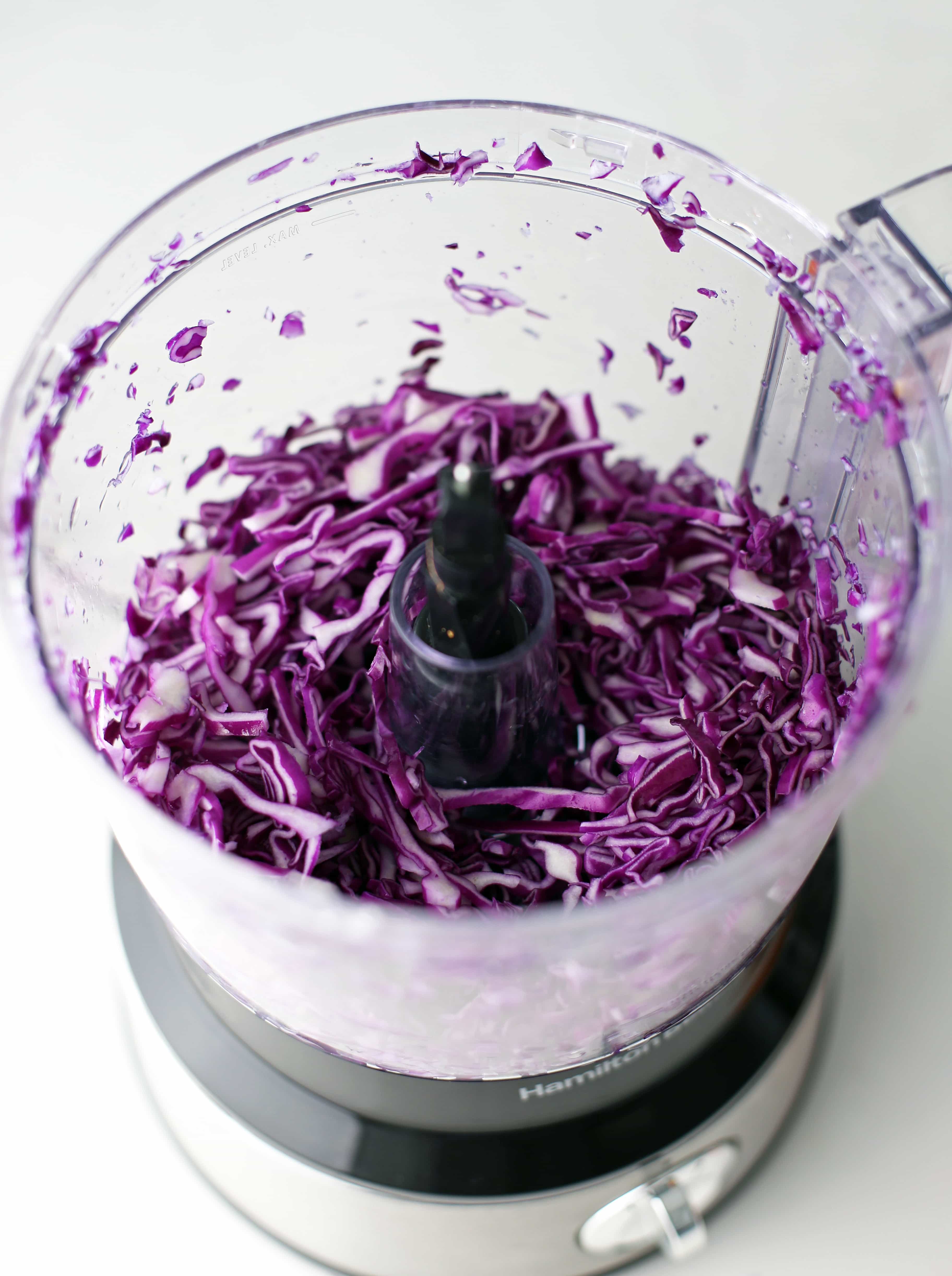Shredded red cabbage in a food processor.