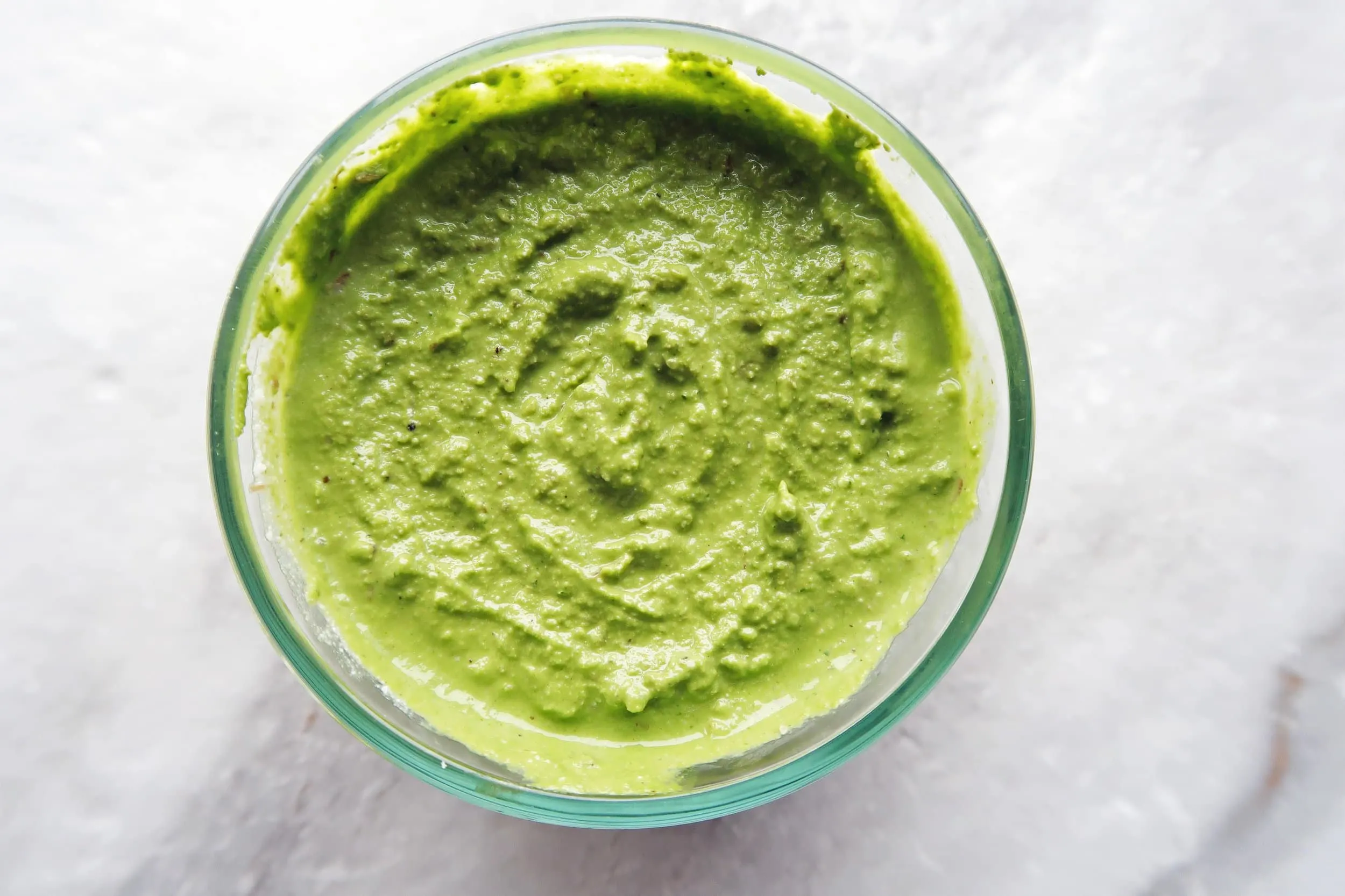 A smooth and creamy pesto in a bowl.