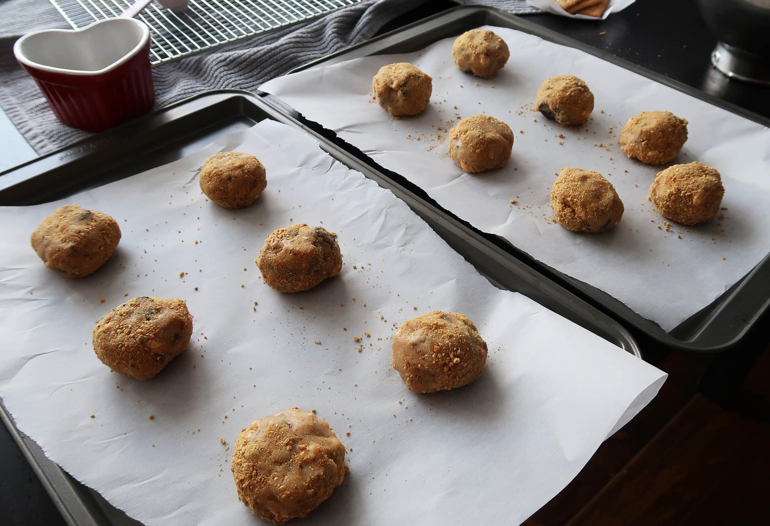 S'more cookie dough balls on a baking sheet.