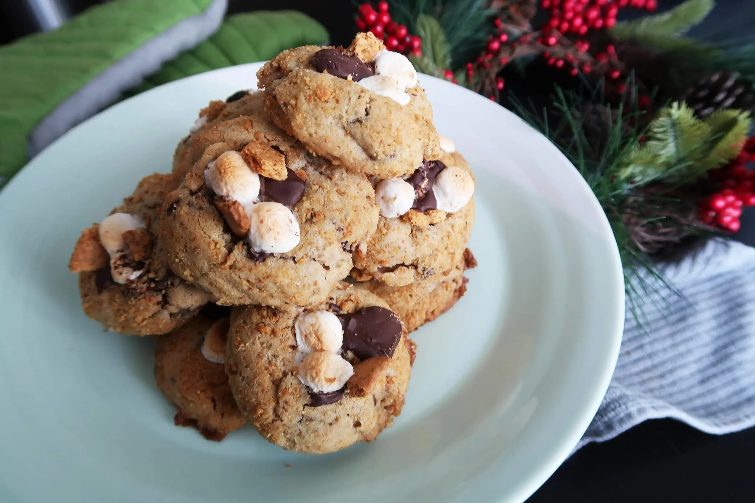 A pile of Soft and Chewy S'more Cookies on a plate.