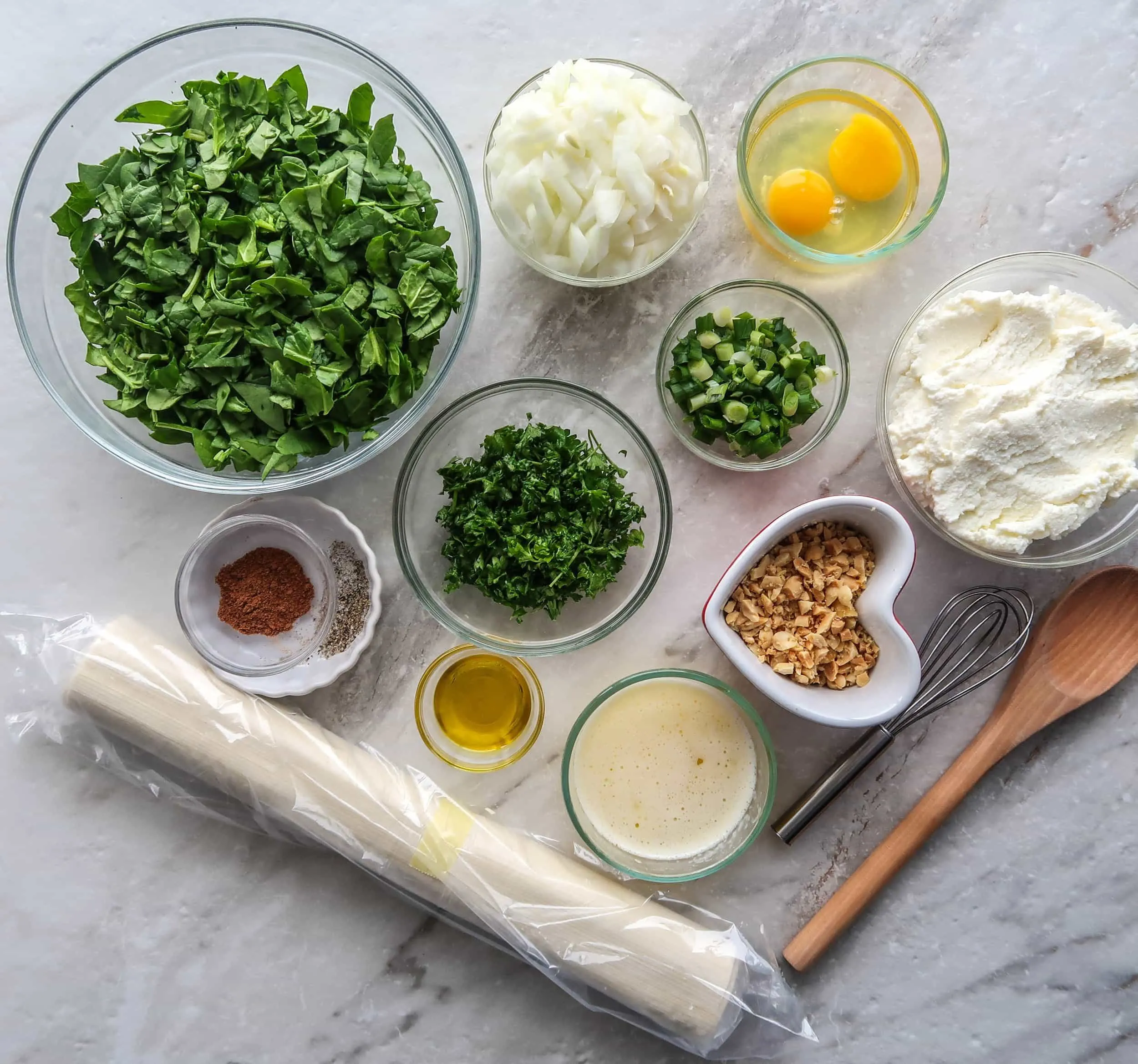 Spinach, onions, parsley, ricotta, eggs, and phyllo dough.