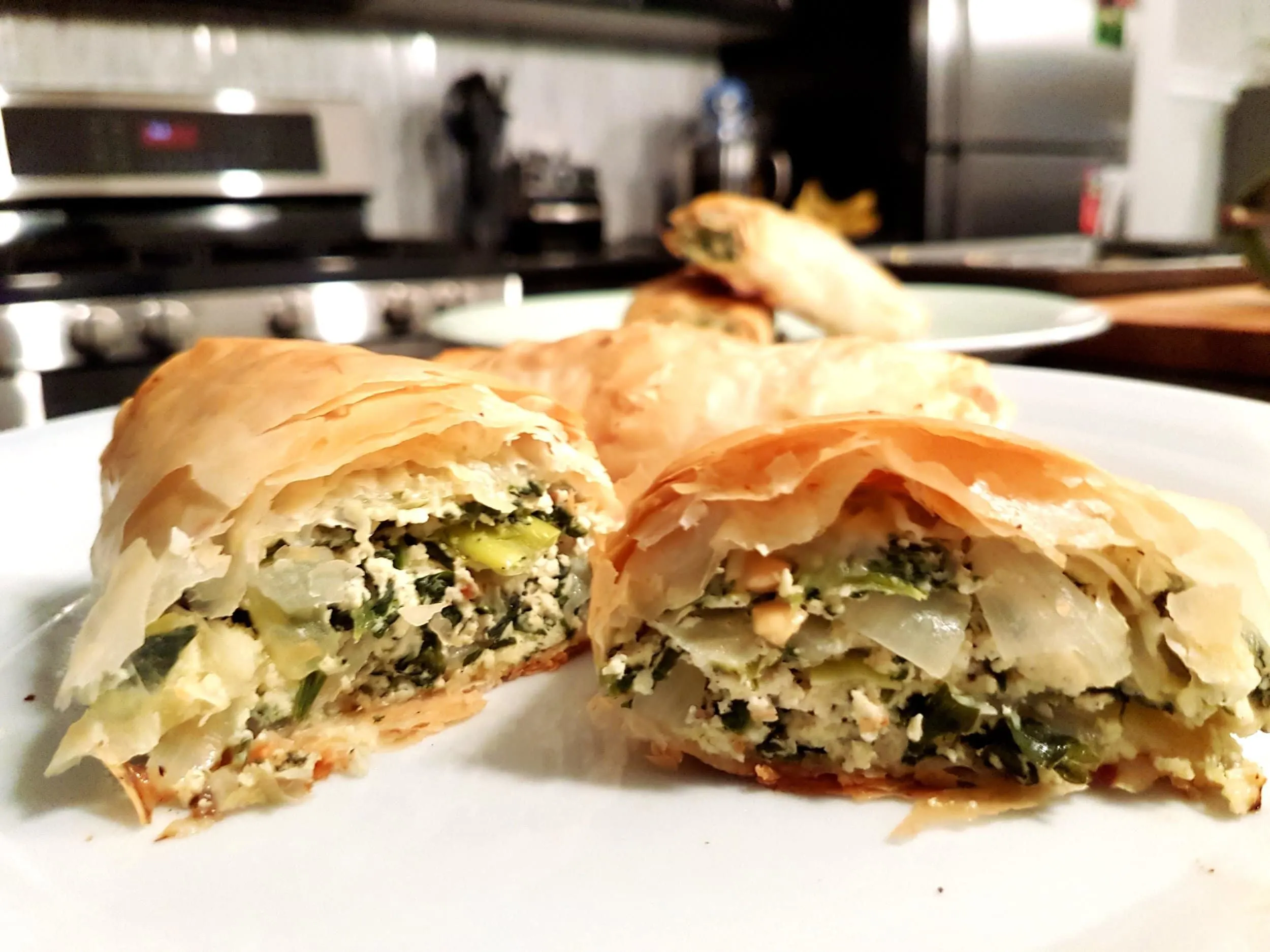 A spanakopita roll cut in half.