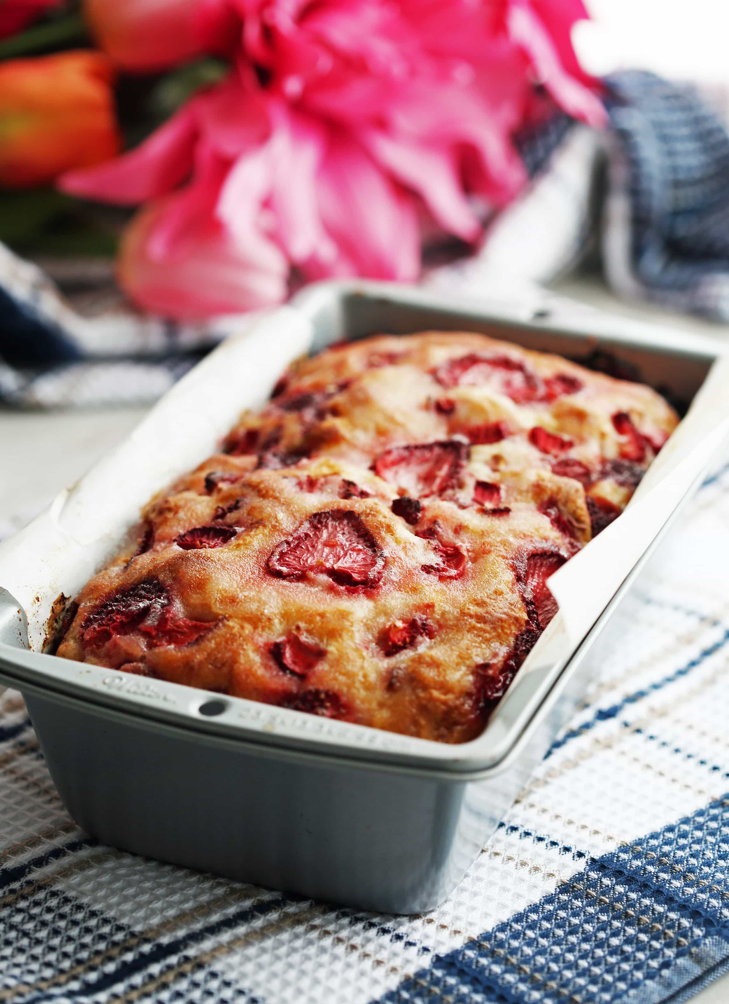 Freshly baked Strawberry Lemon Yogurt Quick Bread in a metal loaf pan.