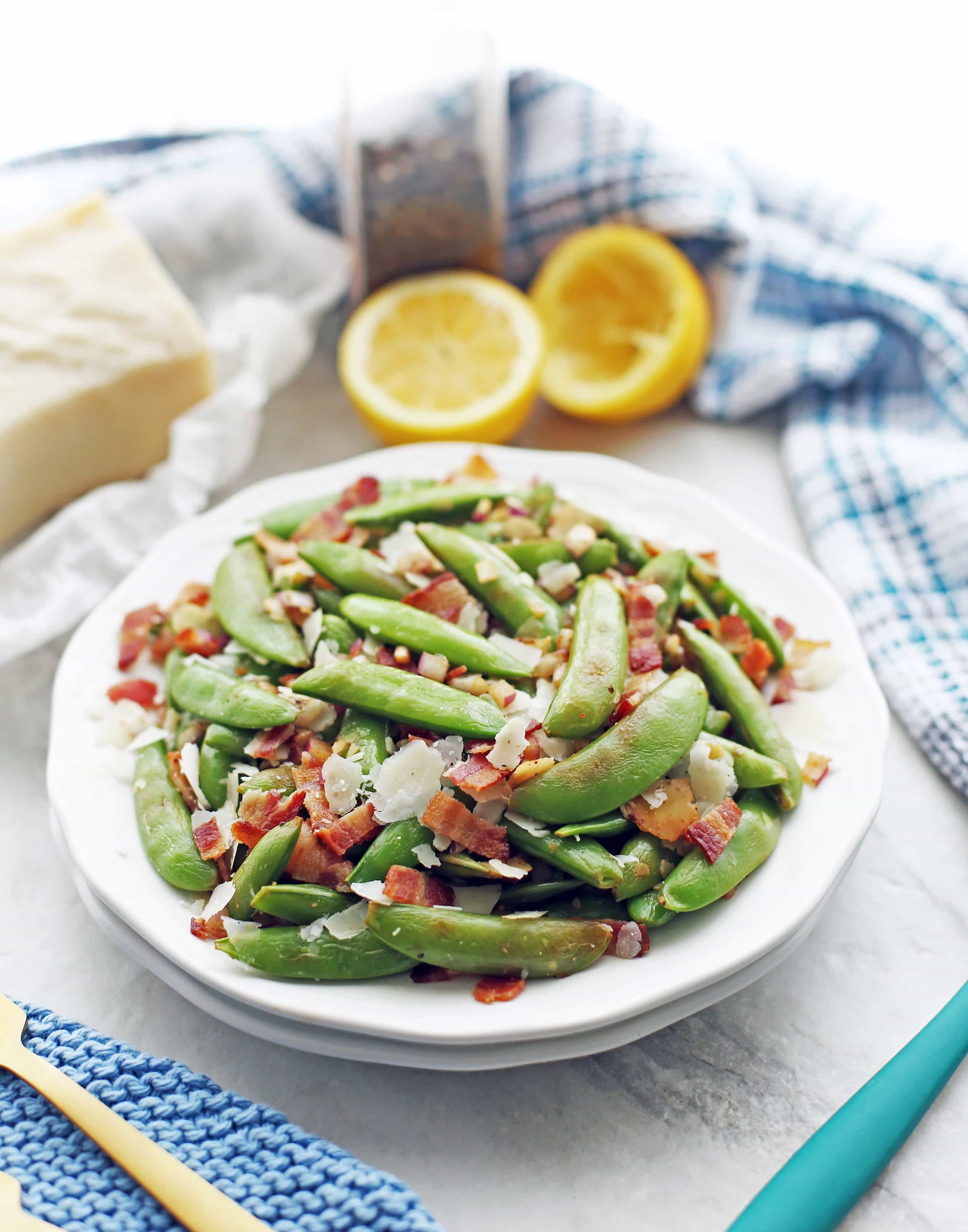 A heaping plate of sugar snap peas with bacon and parmesan.