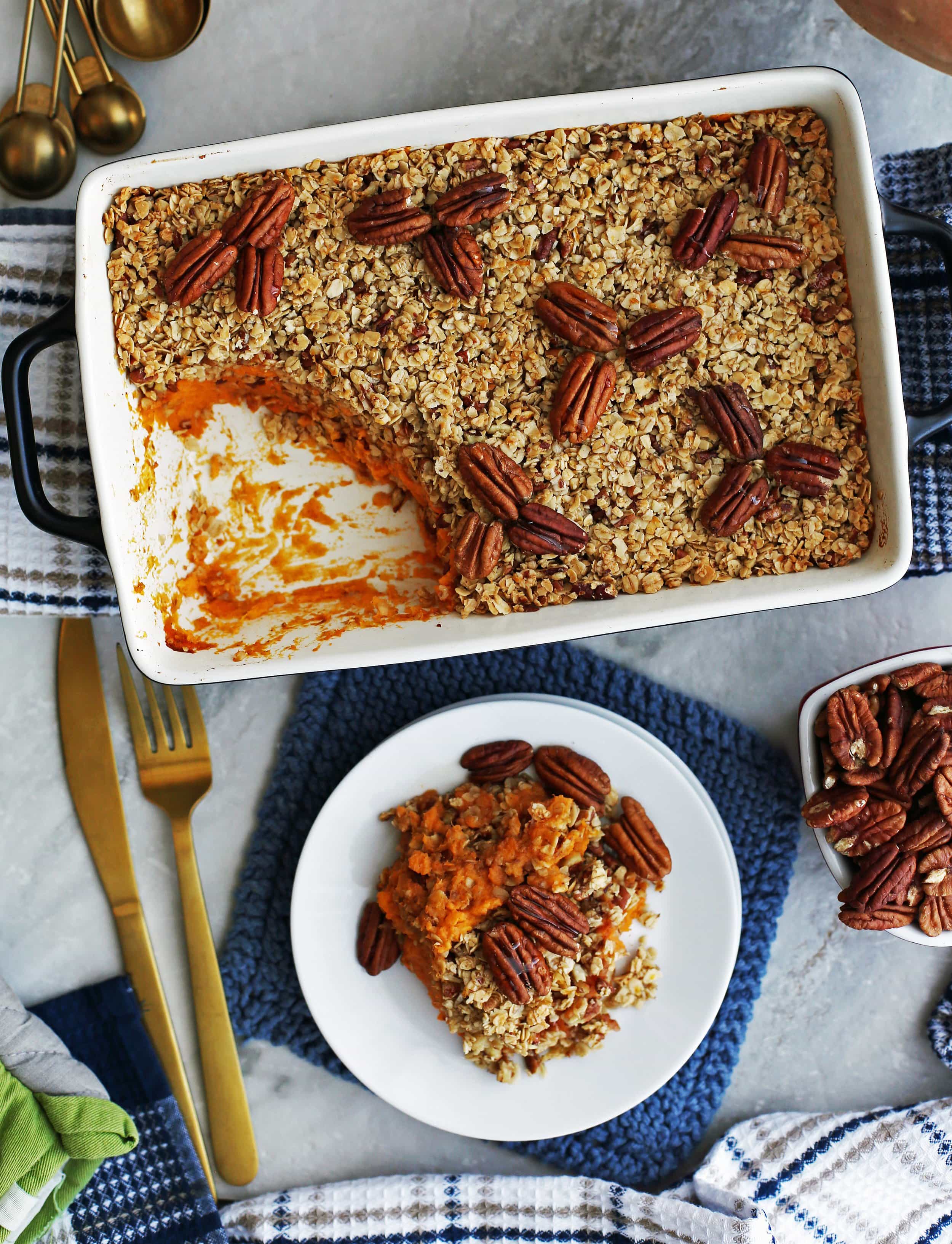 Overhead view of Sweet Potato Mash with Oat Topping on a white plate and in a casserole dish.