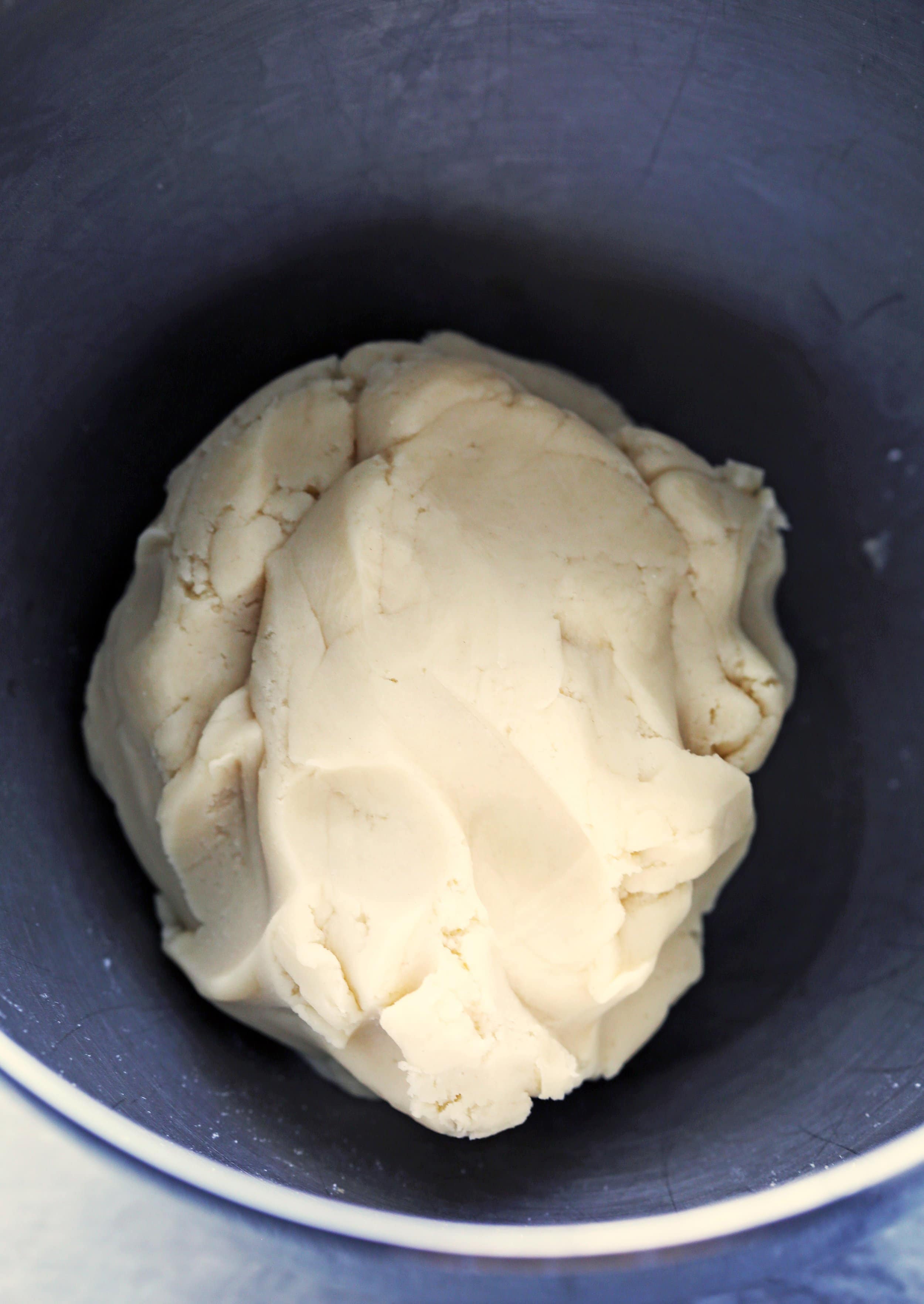 Shortbread Cookie dough in a large metal bowl.